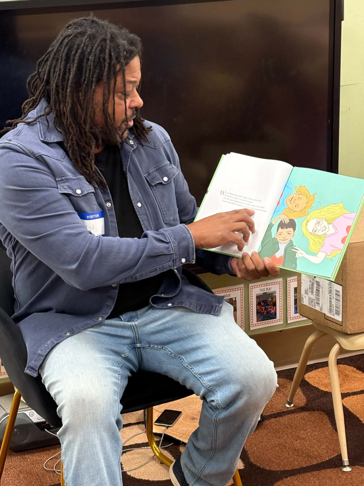 Rod Cornish reading the book aloud to a class